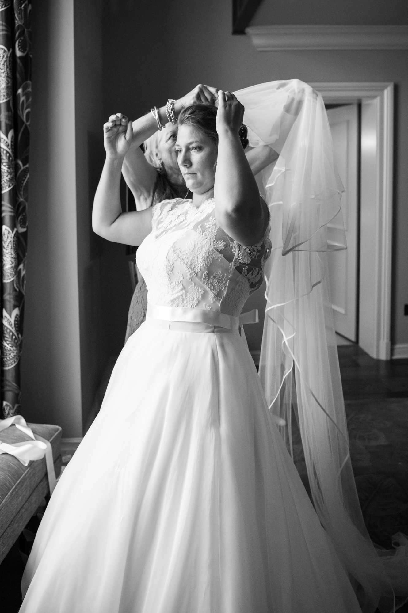 A bride trying on her wedding dress by Sarah Elizabeth Bridal